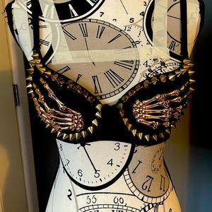 Black and gold studded skeleton hands bra! Size small.